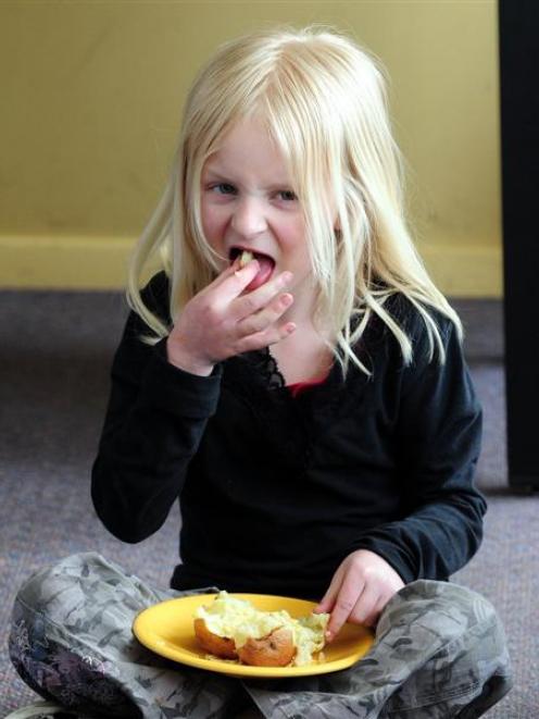 Calton Hill Primary School pupil Reyana Wilson (8) tucks into a baked potato at school. Photo by...