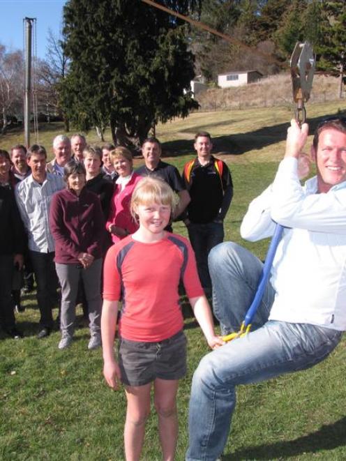 Cambridge Principals' Association chairman Mike Pettit gets a helping hand in the Tarras School...