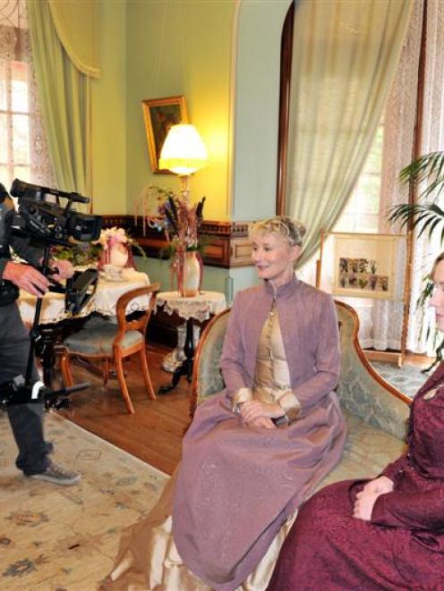 Cameraman Patrick O'Neill films Lyndall Frost (left) and Robyn Swindells in the Larnach Castle...