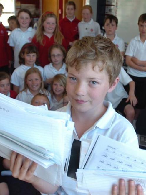 Cameron Donaldson (10) holds the results of a random bedtime survey carried out by the Otago...