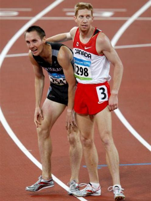 Canada's Kevin Sullivan, right, and New Zealnd's Nicholas Willis react after a men's 1500-meter...