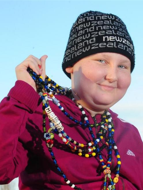 Cancer patient Madie King, at her Dunedin home, with her beads of courage. Photo by Craig Baxter.