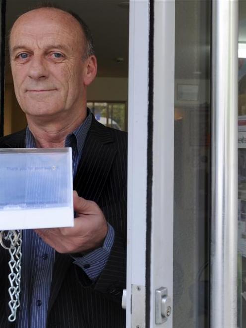 Cancer Society Otago Southland division chief executive Mike Kernaghan with a donation box...