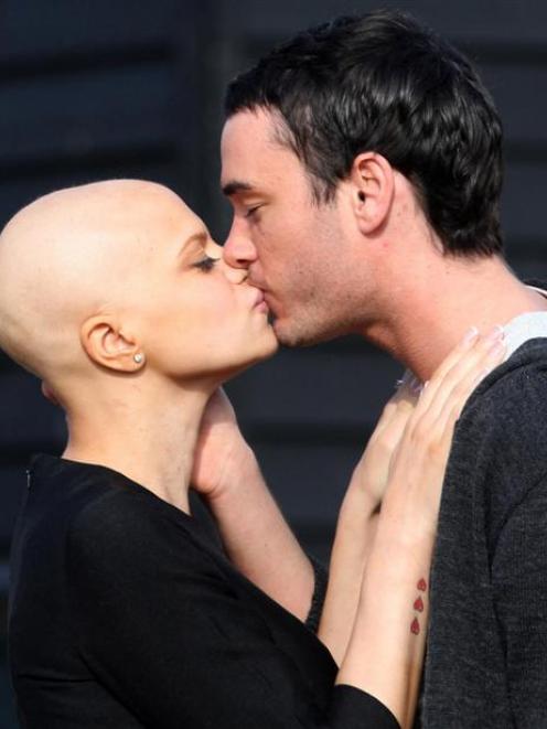 Cancer-stricken reality TV star Jade Goody and her fiance Jack Tweed, right, share a kiss on the...