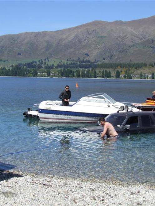 Cantabrians Michael Horgan, Harry McArthur and Jay French (in water) try to extricate Mr French's...