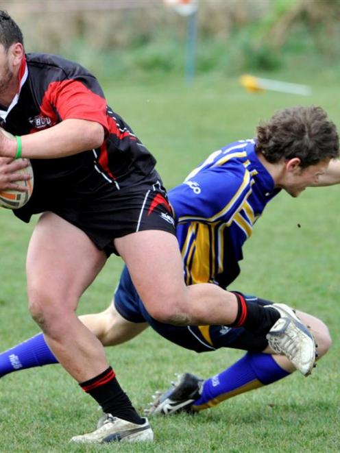 Canterbury A prop John Tafua steps past the attempted tackle of Otago's Tom Bywater during the...