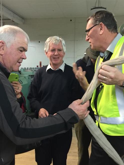 Canterbury woolgrowers Neil Evans (left) and Bernie Cooney discuss the processing of a new carpet...