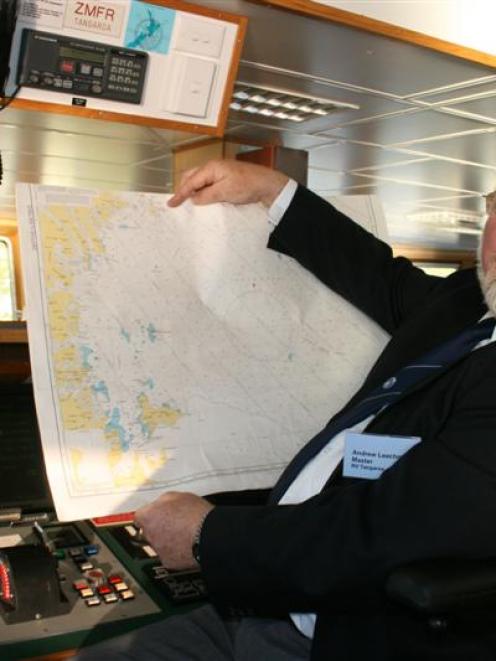 Captain Andrew Leachman with a map of the Ross Sea. Photo by Nigel Benson.