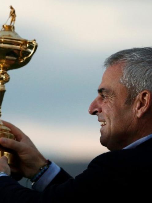 Captain Paul McGinley poses with the trophy after the closing ceremony of the 40th Ryder Cup at...