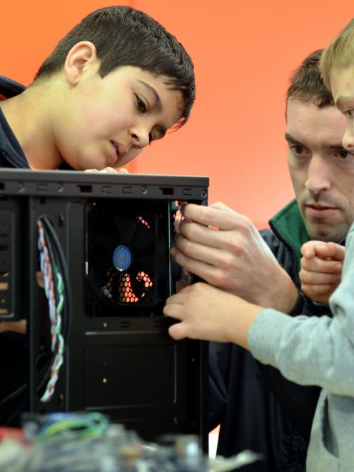 Carisbrook School pupils Raj Prasad (left) and Fisher Huddy (both 10) make light work of building...