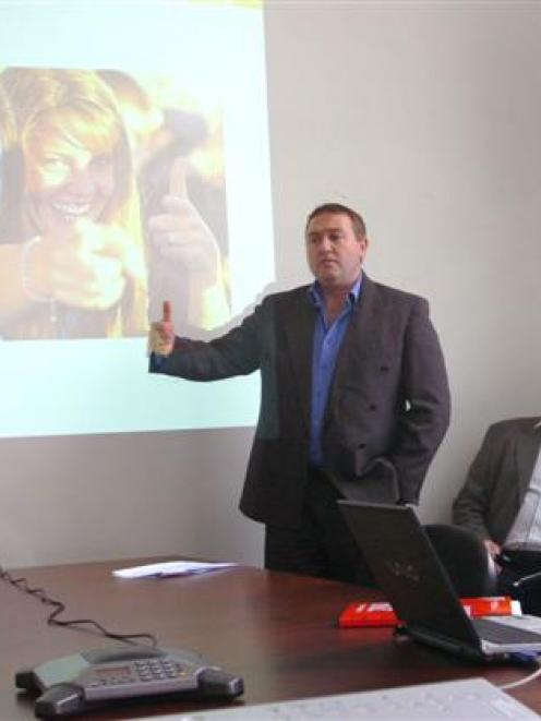 Carisbrook Stadium Trust commercial manager Guy Hedderwick (standing) explains the trust's new...