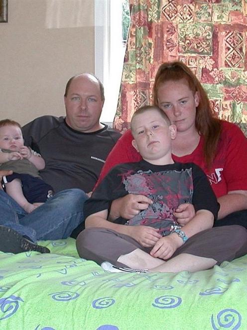Carl and Toni Dock-Walshe rest with sons Michael and Jamie in their guest sleep-out after the...