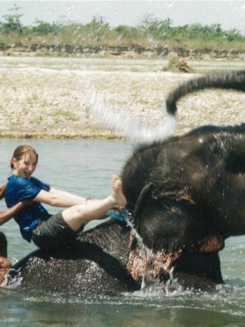 Carolyn Beaver rides an elephant in Nepal on her way to work as a vet in the UK. Photos supplied.