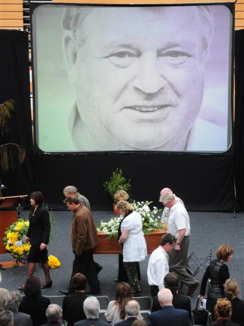 Carrying Duncan Laing's coffin from yesterday's funeral service at the Edgar Centre are (from...
