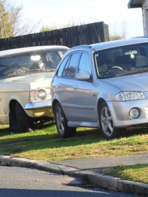 Cars parked on a grass verge in Dunedin yesterday.