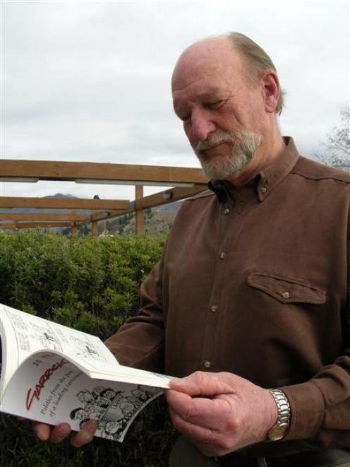 Cartoonist Garrick Tremain flicks through his latest book, comprising his best cartoons from the...