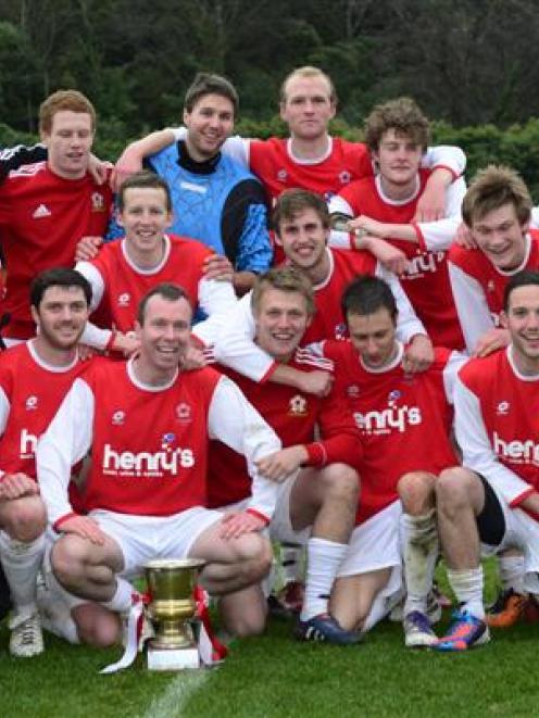 Caversham players and management celebrate their 2012 premier league title. Photo by Gerard O'Brien.