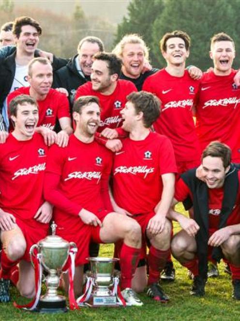 Caversham players celebrate another Football South Premier League title at Sunnyvale on Saturday....
