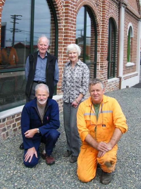 Celebrations ahead: Dunedin Gasworks Museum Trust board members (standing, from left) Bill Cowan,...