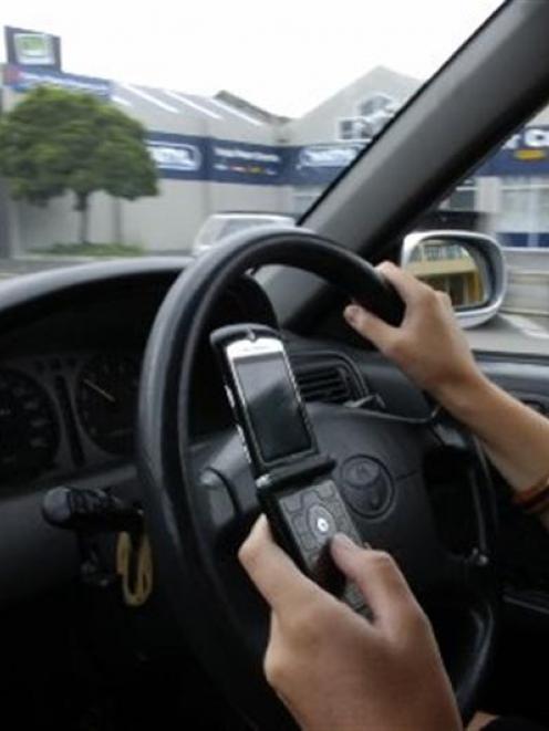 A University of Otago professor, Liz Franz, wants drivers to be banned from any use of cellphones...