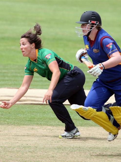Central Districts Kate Broadmore fields off her own bowling to run out Otago's Rebecca Heenan...