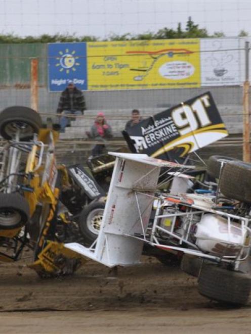 Central Motor Speedway drivers, from left, Mark Evans (yellow), Andy Erskine (91T), Jason Scott ...