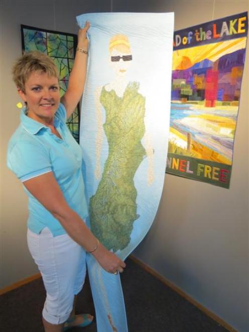 Central Otago Outside the Square (Coots) member Wendy Ward, of Queenstown, presents one of three...