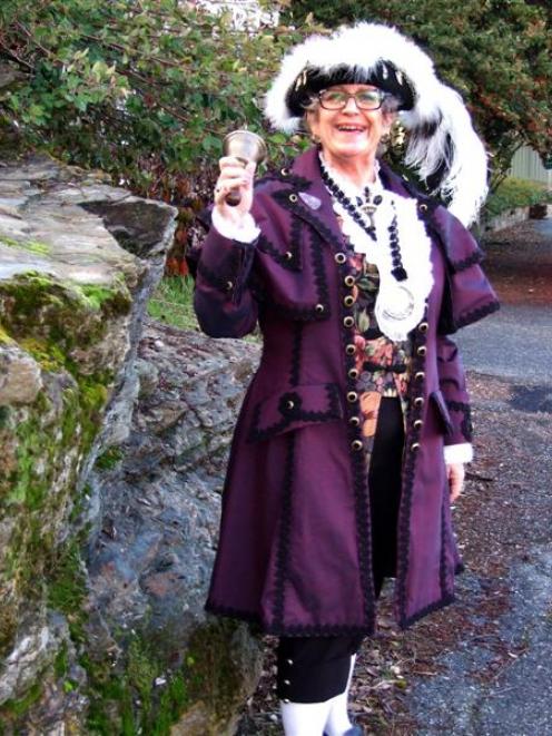 Central Otago Town Crier Paddy-Ann Pemberton exercises her vocal cords in preparation for the...