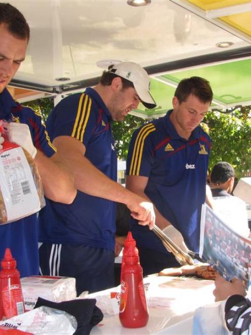 Charity sausage sizzles, like this one in Queenstown in 2010 featuring Highlanders  Israel Dagg,...
