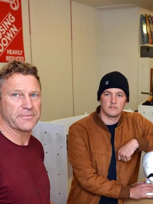 Cheapskates Dunedin co-owner Mark Browne (left) and manager Chris Stephenson pack up stock from...