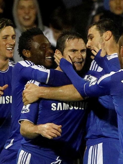 Chelsea's Frank Lampard (C) celebrates with teammates after scoring with a penalty against Fulham...