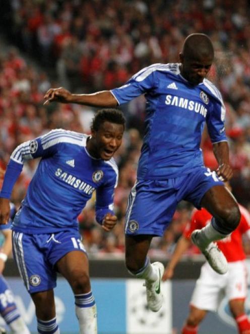 Chelsea's Ramires heads the ball in front of Benfica's Javi Garcia (R) during their Champions...
