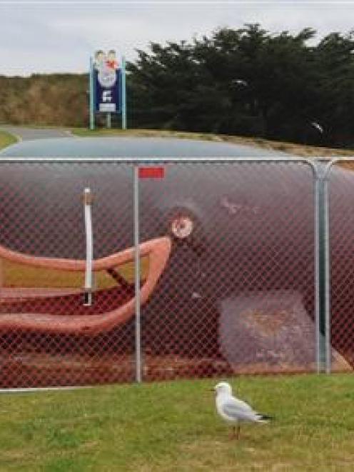 Children look at the whale paddling pool at Marlow Park in St Kilda, Dunedin, which is closed for...