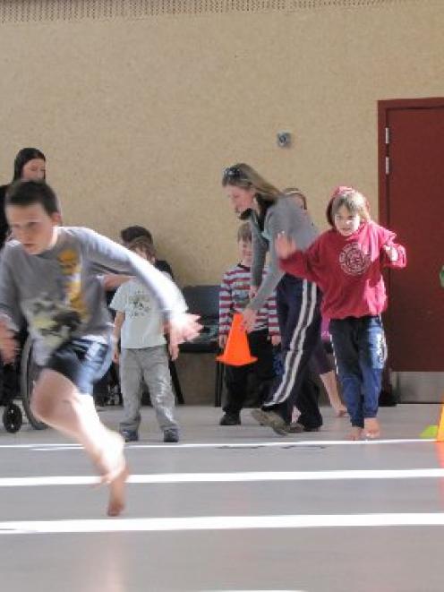 Children participate on the first meeting of the Special Olympics Central Lakes club, at...