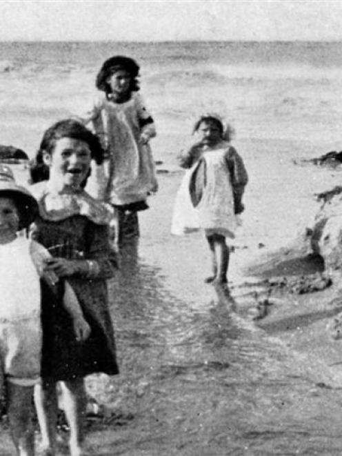 Children playing on the sands at Hampden Beach, Otago. – Otago Witness, 25.8.1915. Copies of...