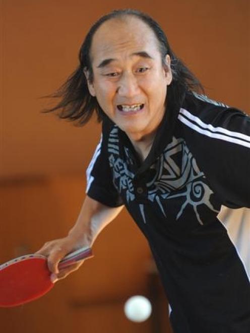 Chinese table tennis coach Wang Qi gives a demonstration at College Street School in Caversham...
