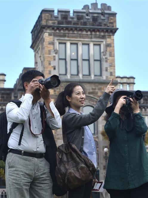 Chinese tourists (from left) Ningsheng Li, Chan Li and Jinmin Shan, of Nanjing, visit Larnach...