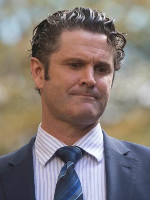 Chris Cairns leaves Southwark crown court in London. REUTERS/Neil Hall