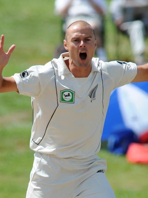 Chris Martin reacts while bowling against Pakistan during the first test in Hamilton earlier this...