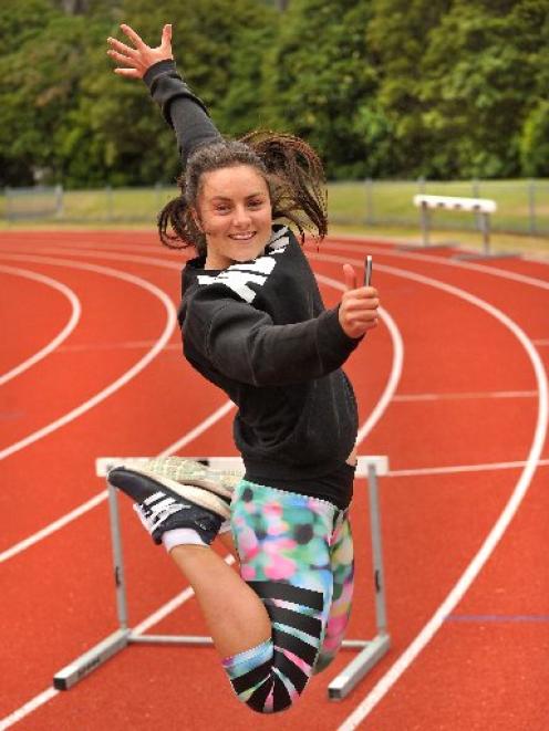 Christina Ashton celebrates her NCEA results during a hurdle training session at the Caledonian...