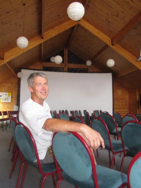 Cinema Paradiso operator Calum McLeod relaxes inside the former Catholic church in Wanaka,...