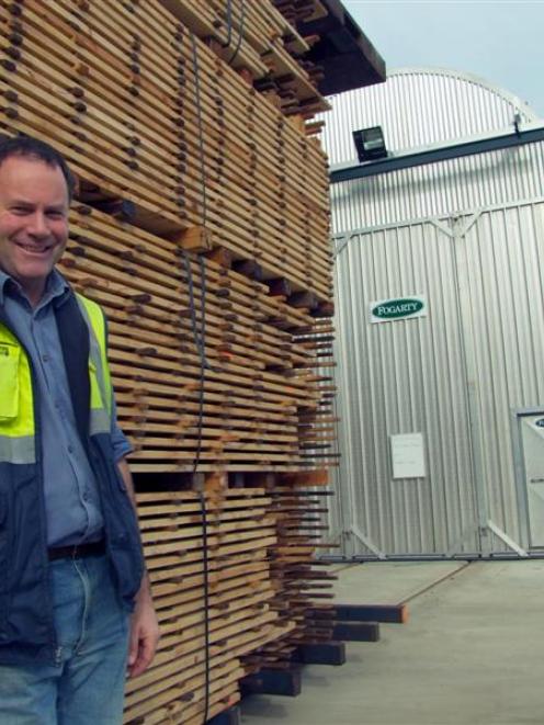 City Forests Ltd wood-processing manager John Speirs stands outside a new drying kiln which was...