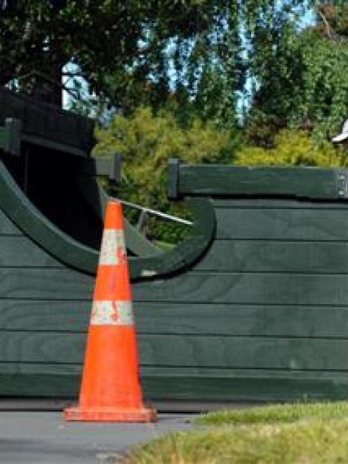 Clean-up continuing ... A bus shelter on Pine Hill Rd lies on its back yesterday after being...