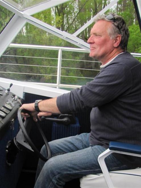 Clutha River Cruises owner Steve Toyer at the helm of his boat Mata-Au, at Alexandra. Photo by...