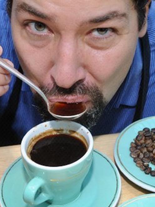 Coffee researcher Mario Fernandez appraises another cup of coffee. Photo by Jane Dawber.