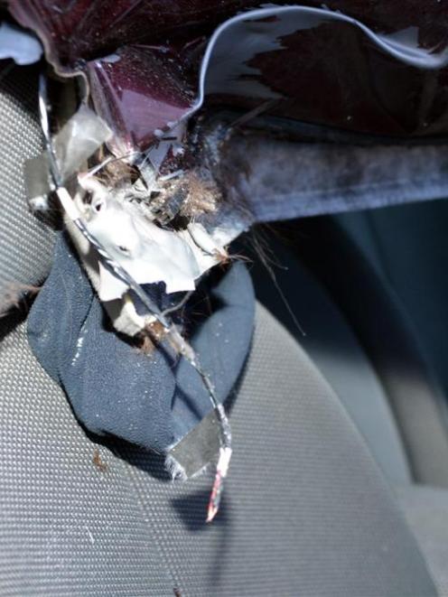 Colin Tumaru's beanie remains pinned between the car roof and driver's seat after the crash.