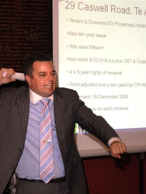 Colliers International national auction manager John Bowring appeals to investors at the Dunedin...