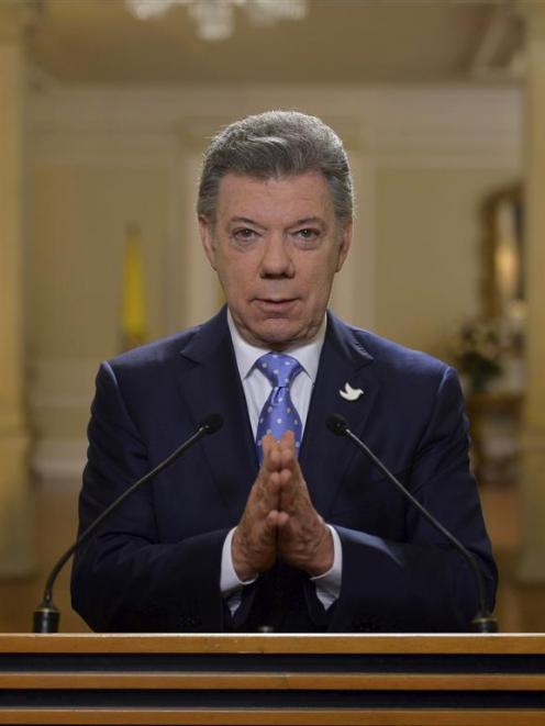 Colombia’s President Juan Manuel Santos speaks to the nation last month following progress in ...