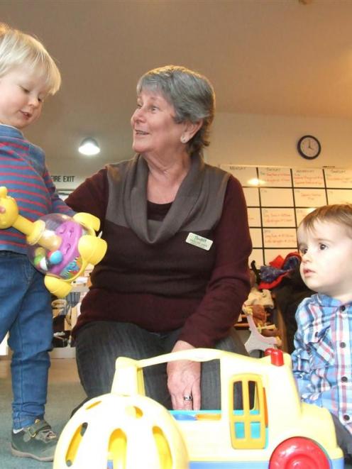 Community Karitane Madeline Lawn, of Queenstown, plays with Jasper Eckford (left) and Lucas...