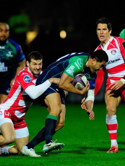 Connacht fullback Mils Muliaina is caught by the Gloucester defence during the European Rugby...